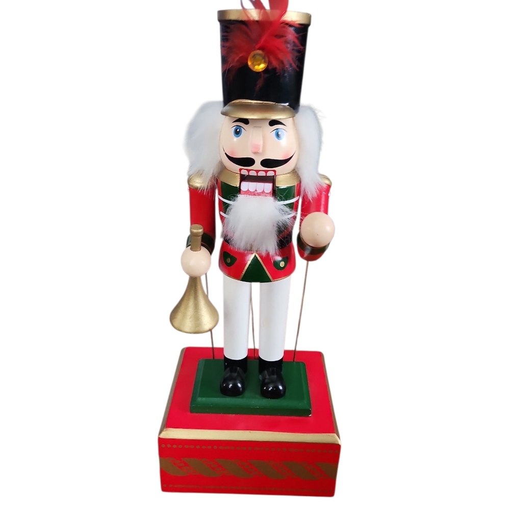 Musical Nutcracker. Moves Arms When Played. Excellent Used Condition. 13" Tall.